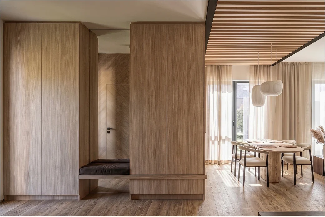 Sage kitchen joinery with pale oak in the Leaf Mint apartment