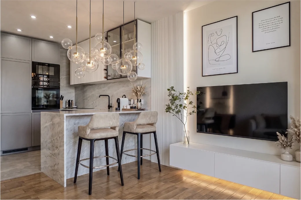 THE NEST — A first family home where a compact plan is made to work harder: a kitchen that seats five and a dining nook built into the structure.
